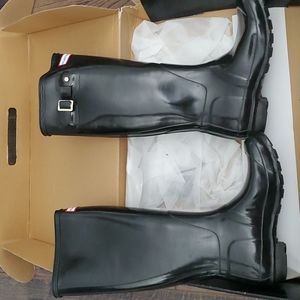Black glossy knee high hunter boots